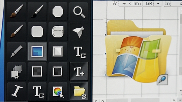 特写Axialis IconWorkshop的绘图工具面板，显示各种绘图工具图标如画笔、形状、文本，旁边是一个正在编辑的Windows文件夹图标，背景为工作区的网格，色彩鲜明，细节清晰。