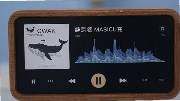 巨鲸音乐盒播放无损音乐格式时的界面特写，显示歌曲名称、专辑封面以及实时的频谱跳动效果，背景为柔和的渐变蓝
